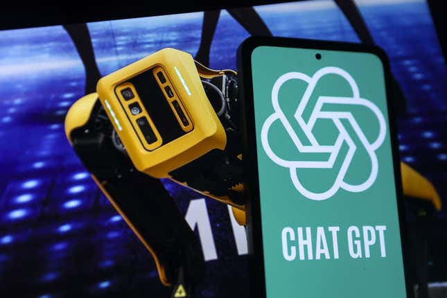 A mobile phone screen displays ChatGPT logo in front of a screen displaying Boston Dynamics robot 'Spot' in Ankara, Turkiye